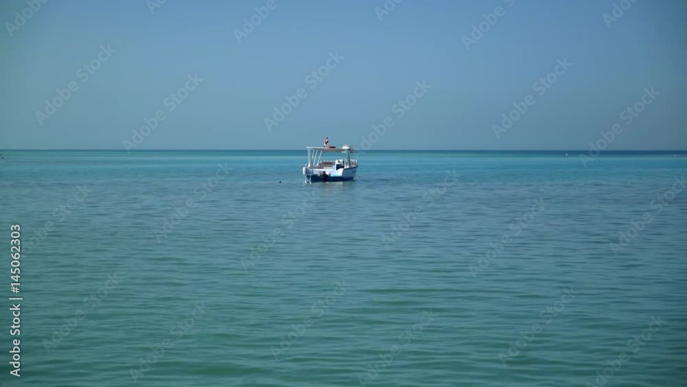 A lonely boat is anchored in the sea. 4k video A lonely boat is anchored in the sea. 4k video