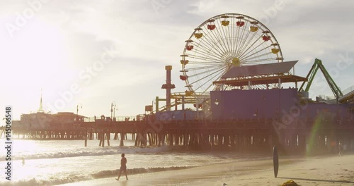Slow motion of people relaxing at Santa Monica Pier.