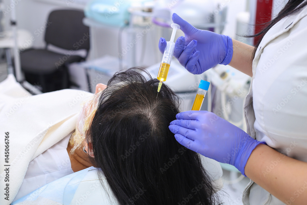 Naklejka premium Researcher performs blood centrifuging