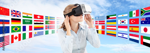 Learn languages in the future technology concept, Woman wearing virtual reality VR glasses. 360 degrees. isolated in blu sky and flags background