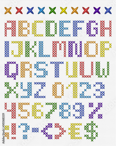 Colorful cross stitch uppercase english alphabet with numbers and symbols. Isolated on white cloth texture