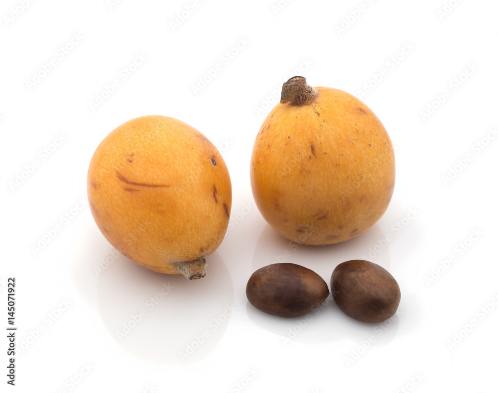 Ripe medlars (Eriobotrya japonica) with bones on a white background. Isolated Ripe medlars (Eriobotrya japonica) with bones on a white background. Isolated