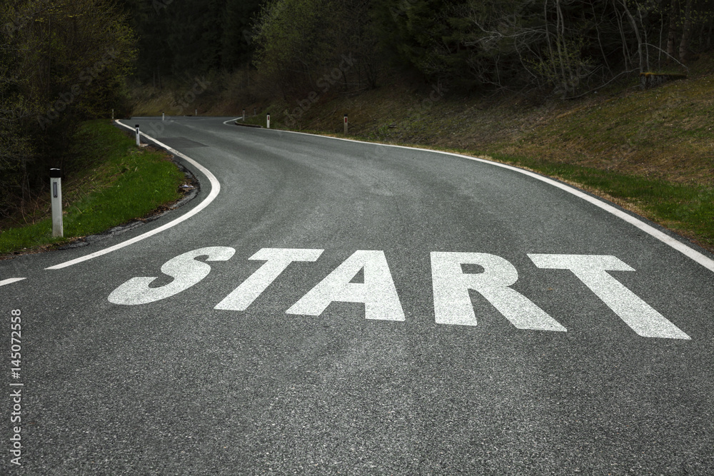 Fototapeta premium Start word message on the winding curved asphalt country road.