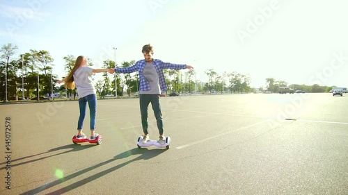 Young couple having fun with scooter