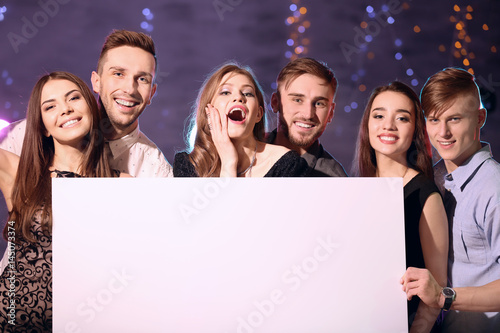 Friends with poster at part...