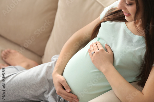 Beautiful pregnant woman si...