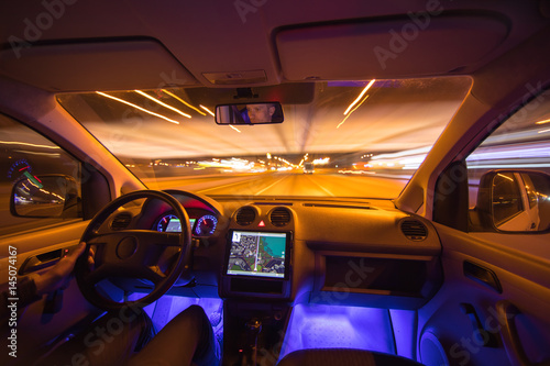 The man drive on the night highway. Inside view. Wide angle © realstock1