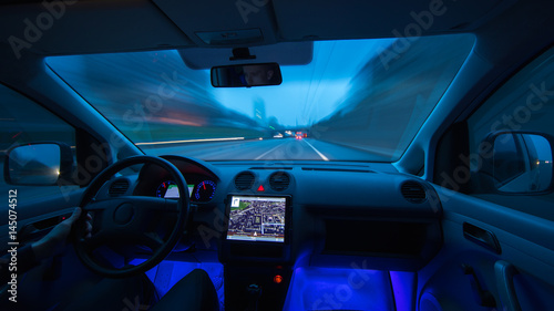 The man drive a car on the evening highway. Inside view. Wide angle © realstock1