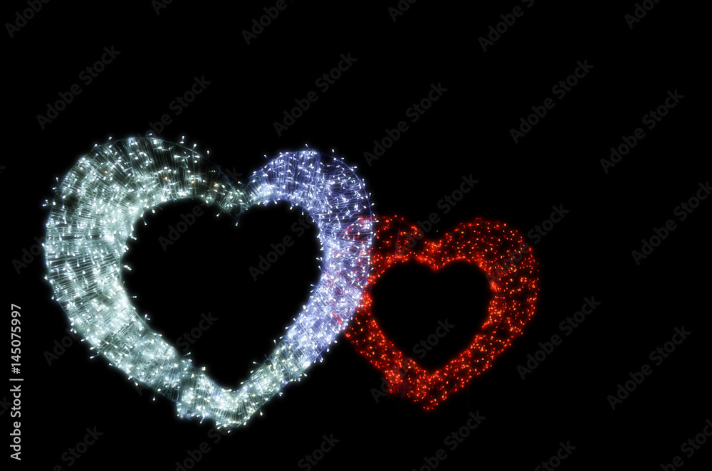 Couple of heart on black background.