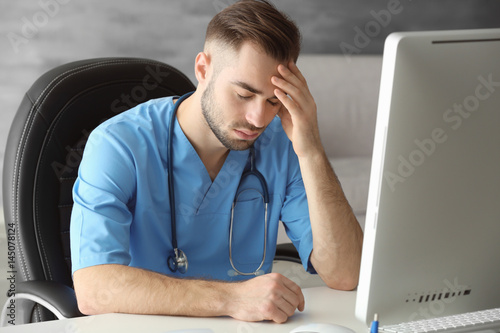 Tired medical assistant in ...
