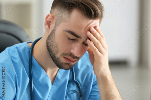Tired medical assistant in ...