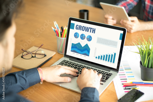 Business Charts Graphs on Screen with GROWTH Concept