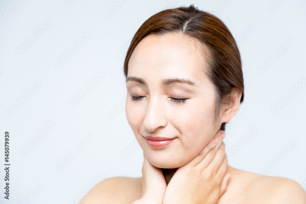 beautiful woman massaging her face. lymphatic massage. beautiful woman massaging her face. lymphatic massage.