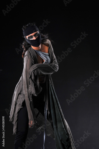  Warrior woman in different design clothes on black background 