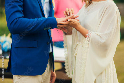 The newlyweds exchange rings at a wedding in Montenegro.