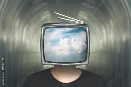 man with television heads in the clouds photo