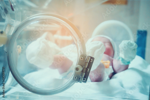 Newborn baby inside incubator in hospital post delivery room © Piman Khrutmuang