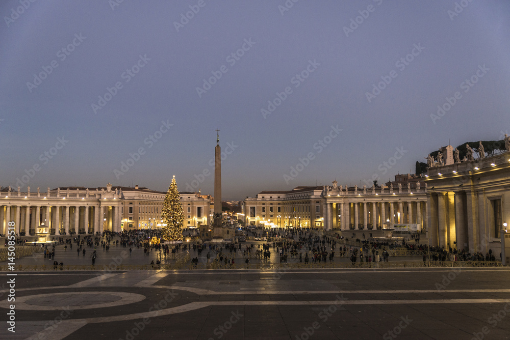 Tourists at Saint Peter's Square at night in Vatican City, Vatican