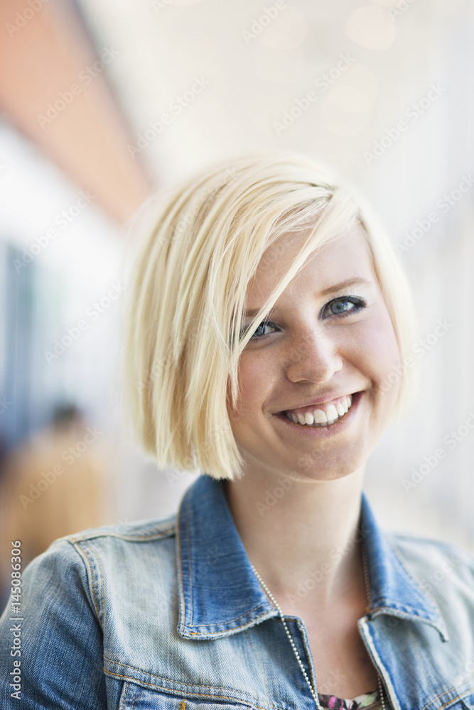 Portrait of happy young blond woman