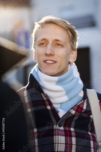 Young man looking gay partner in city photo