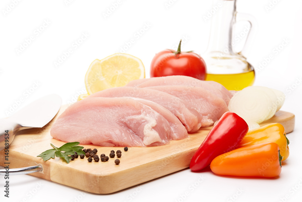 Raw turkey meat fillet and vegetables. Raw turkey meat fillet and vegetables.
