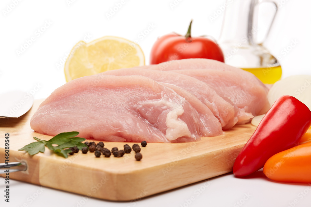 Raw turkey meat fillet and vegetables. Raw turkey meat fillet and vegetables.