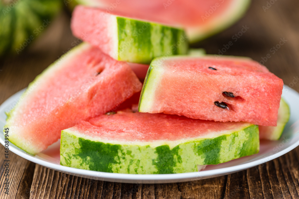 Portion of Fresh Watermelon on wooden background (selective focus). Portion of Fresh Watermelon on wooden background (selective focus).
