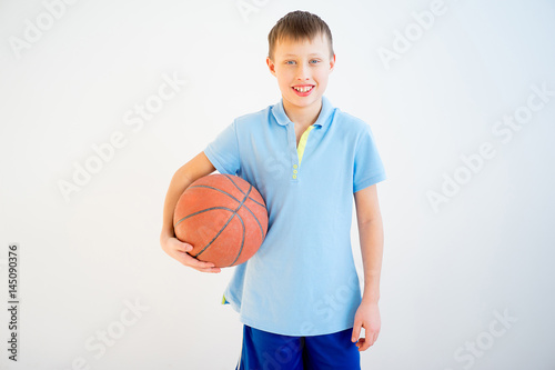 Boy playing basketball © Nichizhenova Elena
