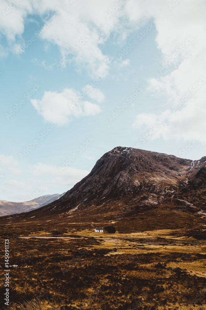 Glencoe mountains on sunny day with blue sky in Scotland. Scottish Highlands.