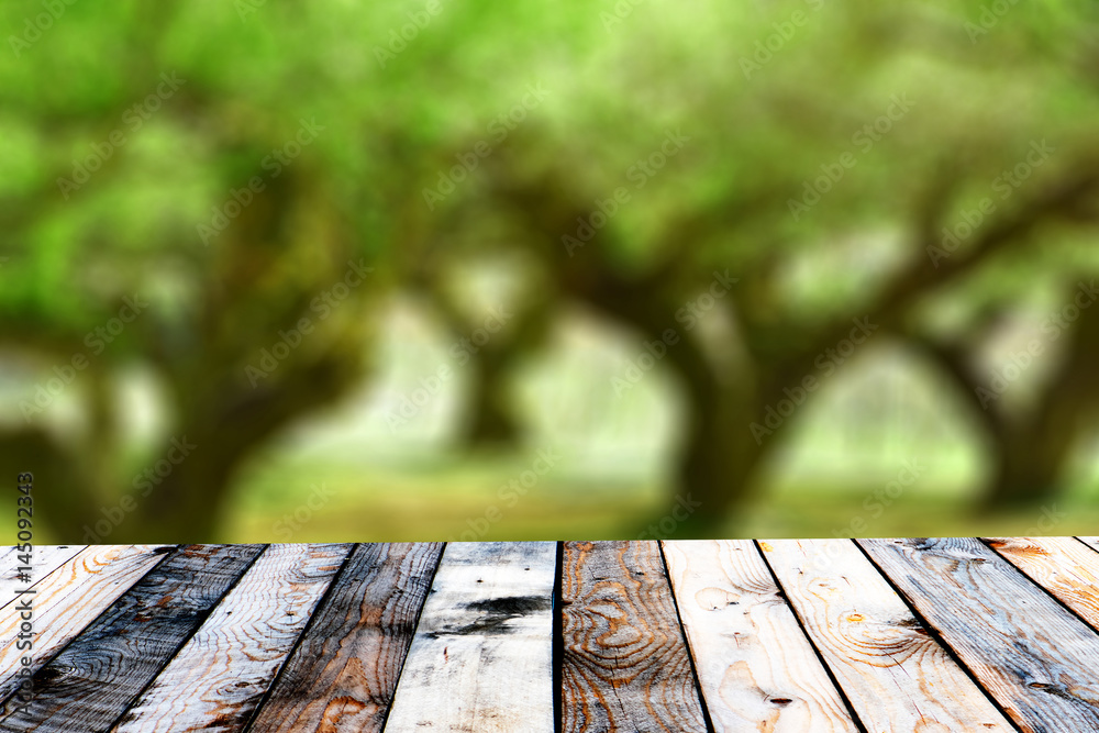 Empty top wooden table and sunny abstract blurred background Empty top wooden table and sunny abstract blurred background