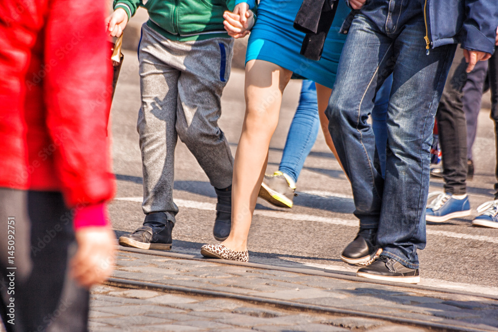 people crossing the pedestrian crossing