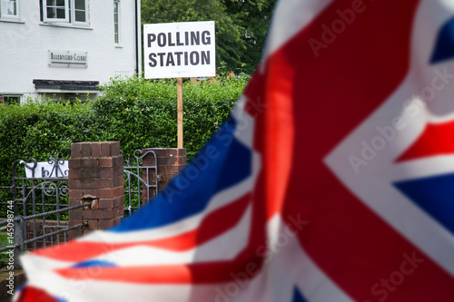 polling station sign and Union Jack flag - UK prepares for elections