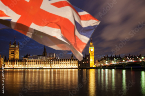 union jack flag and iconic Big Ben at the palace of Westminster, London - the UK prepares for new elections