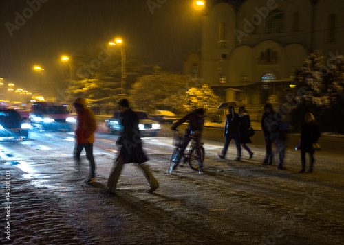 Fototapeta Naklejka Na Ścianę i Meble -  Busy city street people on zebra crossing