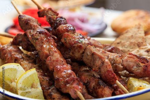 Canvastavla Grilled meat skewers in a dish