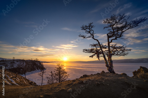 Panorama view of frozen baikal lake during sunset in winter from Olkhon Island view point.