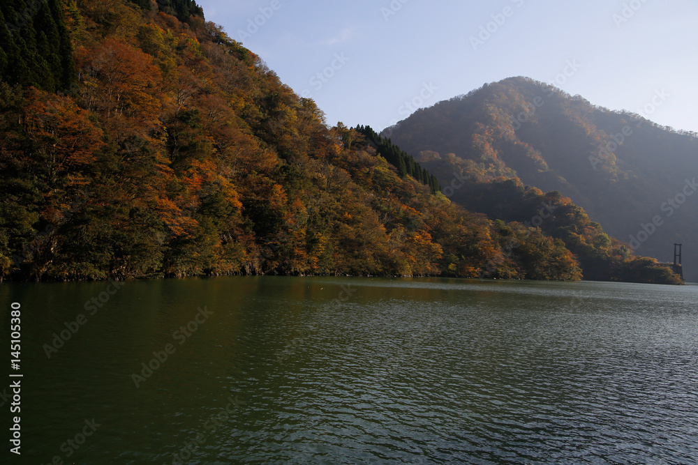 River and autumn leaves and mountains