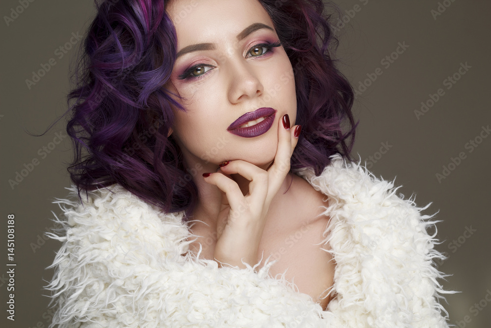 Portrait of young beautiful woman with violet make up and purple hair. Beauty concept. Portrait of young beautiful woman with violet make up and purple hair. Beauty concept.