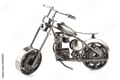 Toy metal motorcycle on white