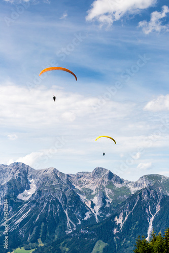 paraglide in front of mountain chain Dachsteinmassiv