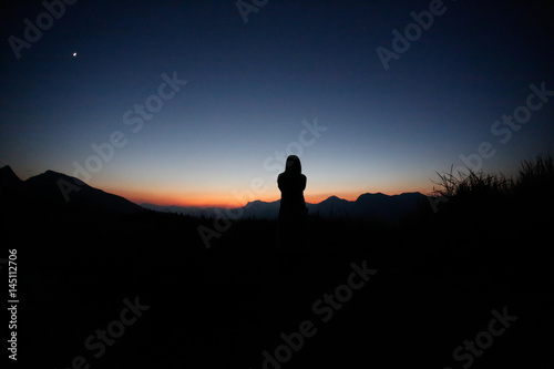 sunset silhouette, young lady in hill