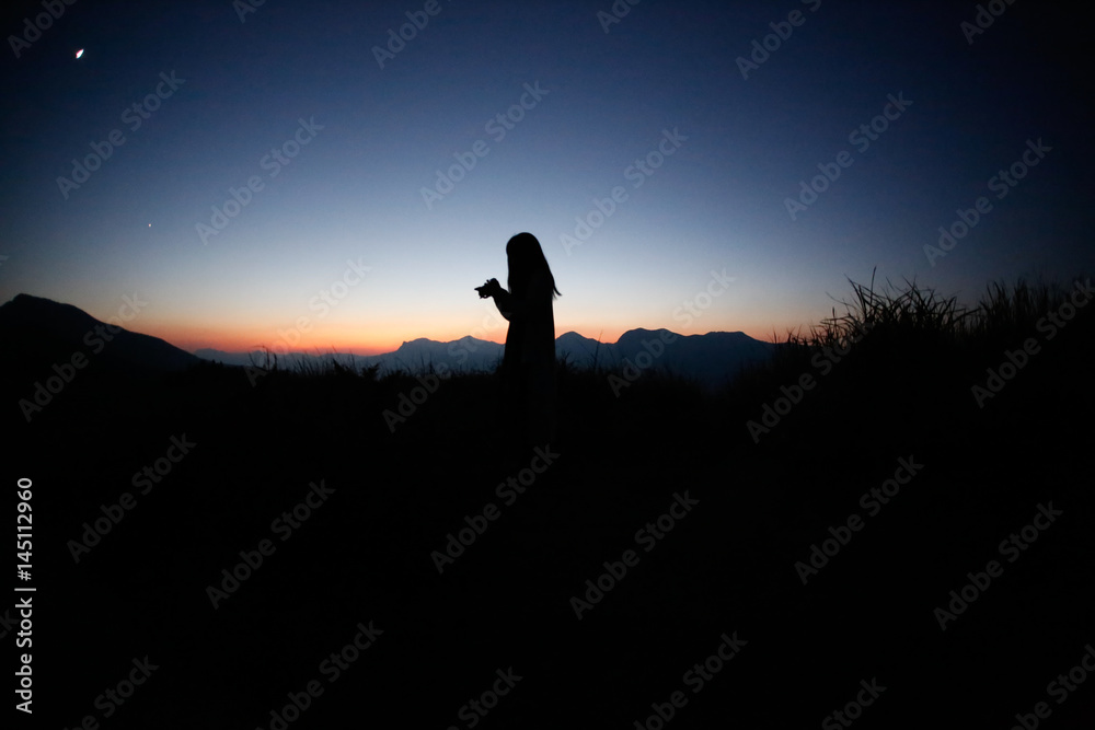 sunset silhouette, young lady in hill sunset silhouette, young lady in hill