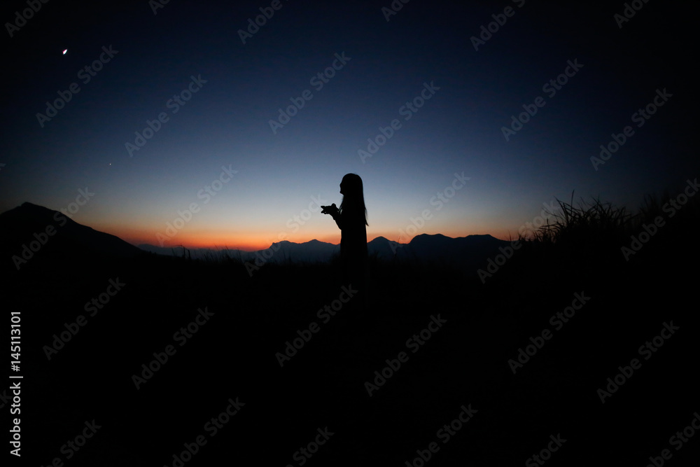 sunset silhouette, young lady in hill