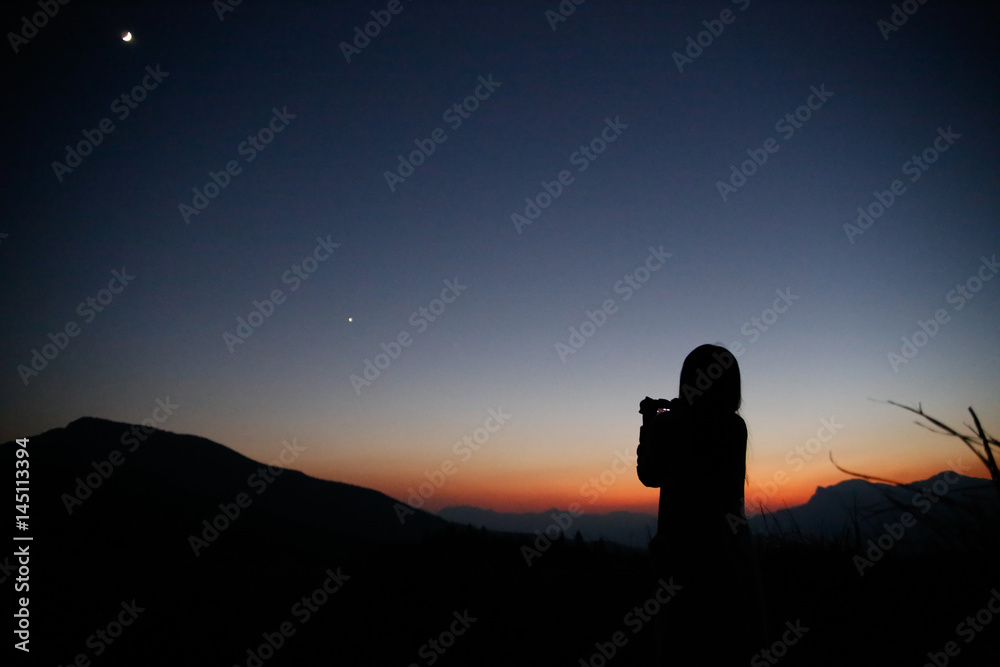 Camera girl at dusk