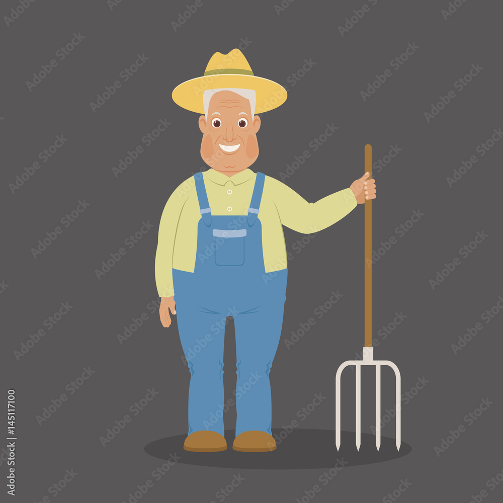 Smiling farmer staying with pitchfork