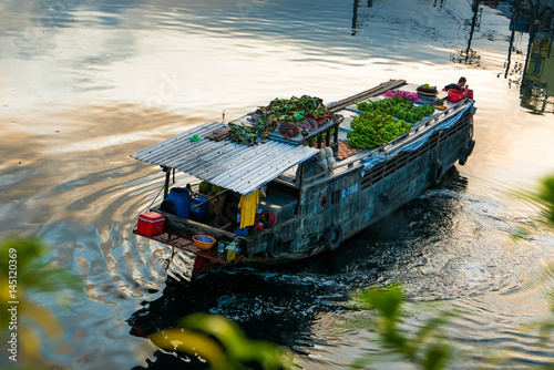 Ho Chi Minh city, Vietnam - April 10 2017: Binh Dong floating market and ancent house, Vo Van Kiet street, Ditrict 6 in dawn photo