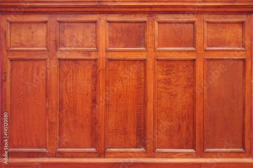 Brown wooden background in a Church. Old decoration texture indoor.