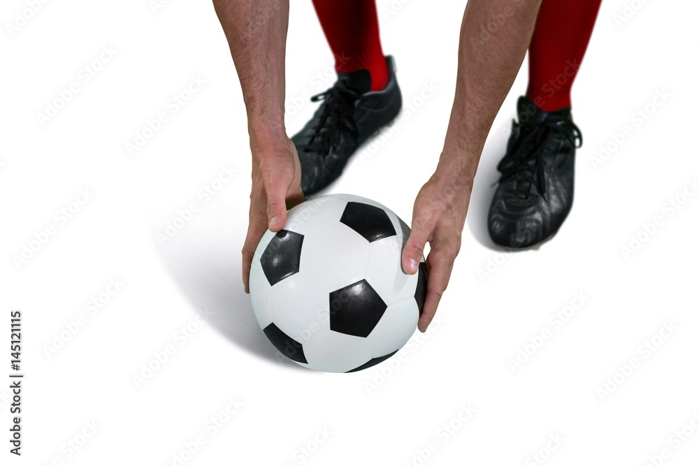 Football player placing football Football player placing football