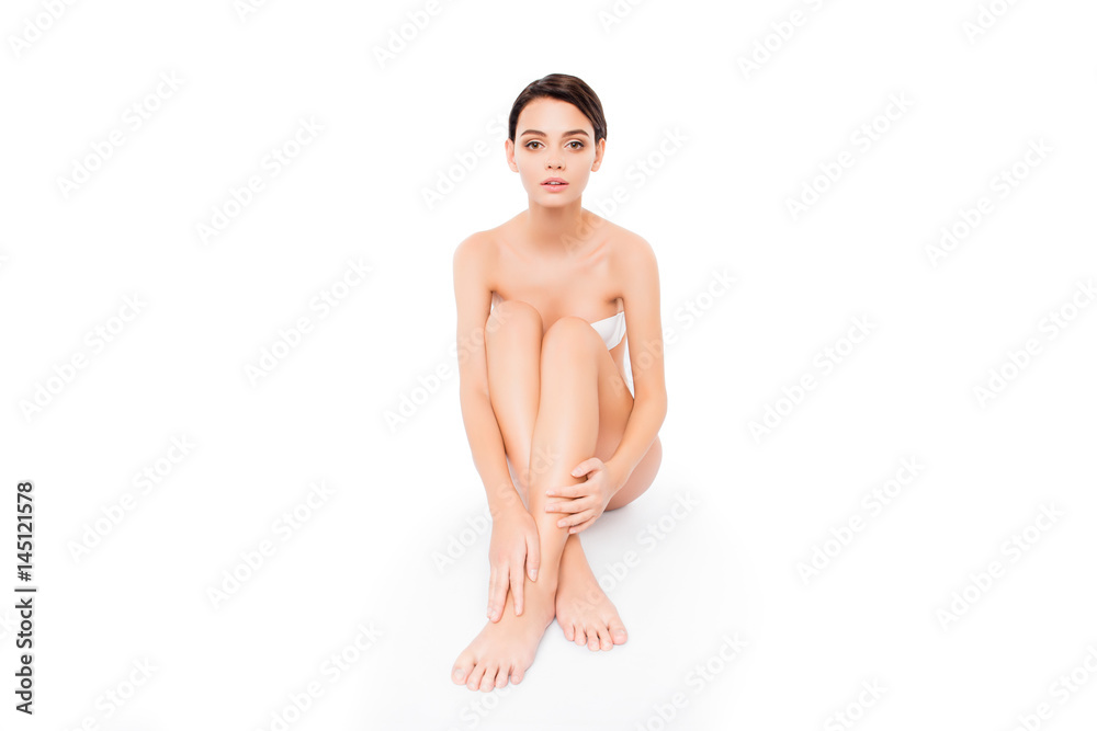 Fototapeta premium Young pretty girl sitting on the floor