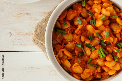 Baked lima beans in white pan photo